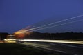 Truck light trails on highway. Art image . Long exposure photo taken on a highway