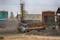 The truck is loaded with bitumen in station