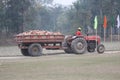 Title: The brick-laden truck goes through the dirt road