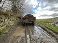 Farm truck, heading into the fields, on a wet and cloudy day near, Wilsden, Yorkshire, UK Royalty Free Stock Photo