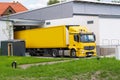 A truck at the loading bay delivers goods to