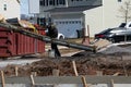 truck mixer pouring concrete cement into a concrete with sidewalk