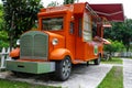 Truck mobile shop for drinks. A tea shop on wheels. Stylish orange truck