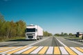 Truck On Country Road. Tractor Unit, Prime Mover, Traction Unit In Motion On Countryside Road In Europe. Business