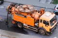 Truck mounted combined vacuum suction and canal jetting machine in action in city utilities