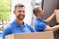 Truck Movers Loading Van Carrying Boxes Royalty Free Stock Photo