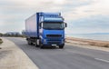 Truck moves along the road along the sea Royalty Free Stock Photo