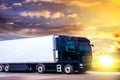 Truck at dawn sun, flashes down the road Royalty Free Stock Photo