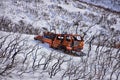 Truck old and rusty graffiti abandoned in the snow covered Mountains Lone Peak Wilderness Wasatch Rocky Mountains, Utah. Royalty Free Stock Photo