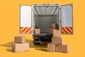 Truck with open back doors, empty cargo space, yellow background, stacked boxes Royalty Free Stock Photo