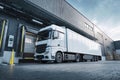 Truck parked at loading dock of modern warehouse with visible cargo during daylight Royalty Free Stock Photo