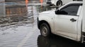 Truck parking at the parking area where is flooded.