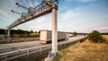 Truck passing through a toll gate on a highway Royalty Free Stock Photo