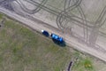 Truck with pesticide tanks for refilling the tractor