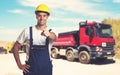 Truck with pointing latin american construction worker