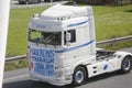 Truck with a protest banner placed in front of the cab during the slow march of hundreds of trucks in a row protesting the rise in Royalty Free Stock Photo