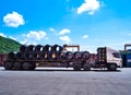 Truck receives steel wire rod from warehouse container unstuffing area. Royalty Free Stock Photo