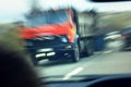 Truck with red cab on the road in motion. Accident rate Royalty Free Stock Photo