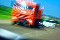 Truck with red cab on the road in motion. Accident rate. View from the cab of the car Royalty Free Stock Photo
