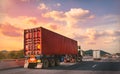 Truck with red container on the highway with sunset time, logistic import export and transport industry concept Royalty Free Stock Photo