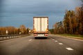 A truck with a refrigerated trailer carries groceries along the highway. The concept of delivery of goods on time, perishable