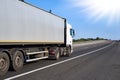 Truck on road with clear container, cargo transportation concept Royalty Free Stock Photo