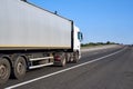 Truck on road with container, cargo transportation concept, closeup object Royalty Free Stock Photo