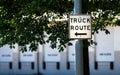 Truck route sign on a steel post