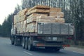 Truck with sawn timber cargo i Royalty Free Stock Photo