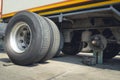 Truck Spare Wheels Tyre Waiting for to Change. Semi Trailer Truck Maintenace and Repairing Royalty Free Stock Photo