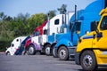 Truck stop with semi trucks various models standing in row Royalty Free Stock Photo