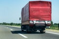 Truck on country highway under blue sky Royalty Free Stock Photo