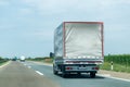 Truck on country highway under blue sky Royalty Free Stock Photo