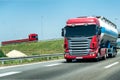 Truck on country highway under blue sky Royalty Free Stock Photo