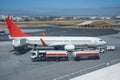 Truck with a tank and a trailer of aviation fuel during the refueling of the aircraft and its service before the flight Royalty Free Stock Photo