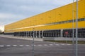 Truck terminal in yellow exterior color. Yellow warehouse. Logistics center with black terminals Royalty Free Stock Photo