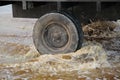 Truck tire going over water in a puddle Royalty Free Stock Photo