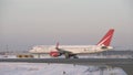 Truck towing Boeing 757 of Russian airline Royal Flight. Winter view