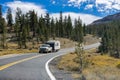 Truck towing a camper on the highway