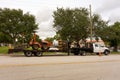 A truck towing a ditch witch in florida