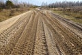 Truck traces on a road Royalty Free Stock Photo