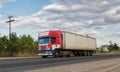 Truck tractor with a container for cargo