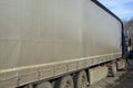 Truck with trailer. Grey awning on truck body. Transport side view. Car on road Royalty Free Stock Photo