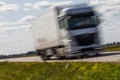 Truck transport on the road with motion blur. Blurred image back Royalty Free Stock Photo