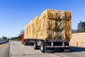 Truck transporting bales of hay on a freeway in Ventura County, South California Royalty Free Stock Photo