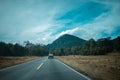 Truck transporting boxes with fruit in the middle of the mountains with forest Royalty Free Stock Photo