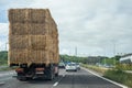 Truck transporting hay bales on a highway Royalty Free Stock Photo