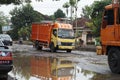 Truck tryng to cross in damaged road