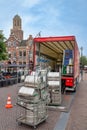 Truck unloading metal beer tuns in Dutch city Zwolle Royalty Free Stock Photo