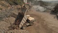 Truck unloads stones in a pile. Royalty Free Stock Photo